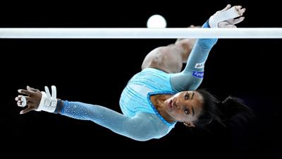 ANTWERP, BELGIUM - OCTOBER 01: Simone Biles of United States warms up on the Uneven Bars during Women's Qualifications on Day Two of the FIG Artistic Gymnastics World Championships at the Antwerp Sportpaleis on October 01, 2023 in Antwerp, Belgium. (Pho...